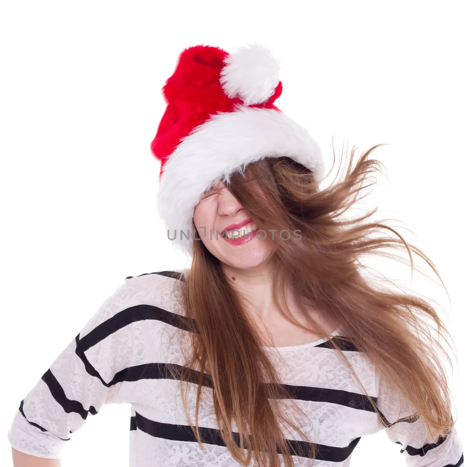 Expressive emotional girl in a Christmas hat on a white background. isolate