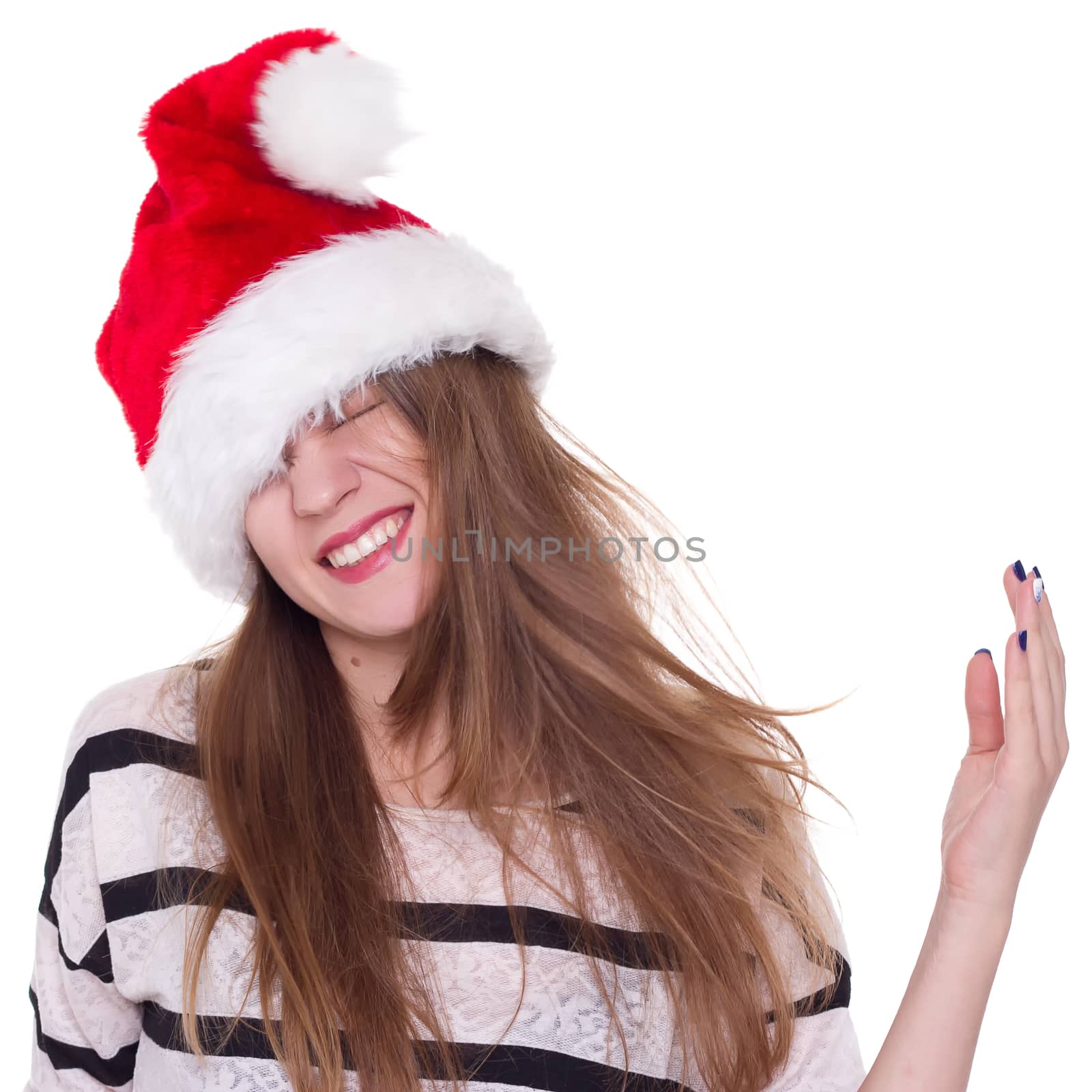 Expressive emotional girl in a Christmas hat on a white background. isolate