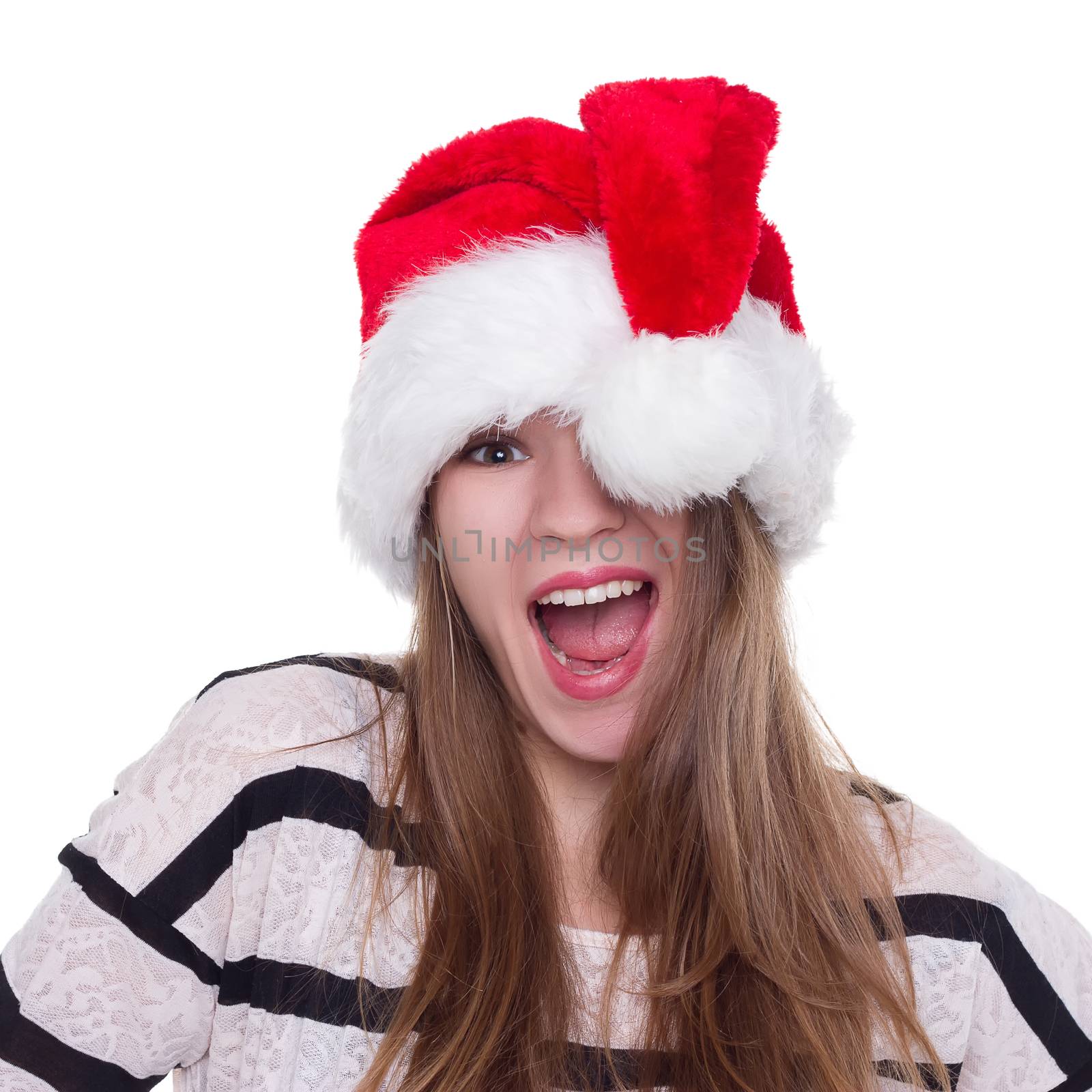 Expressive emotional girl in a Christmas hat on a white background. isolate