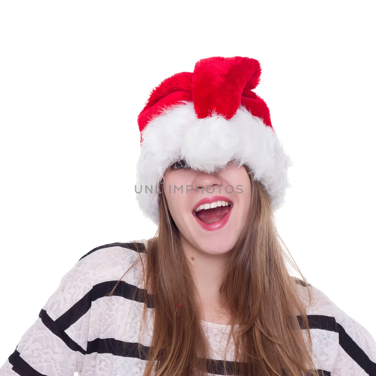 Expressive emotional girl in a Christmas hat on a white background. isolate