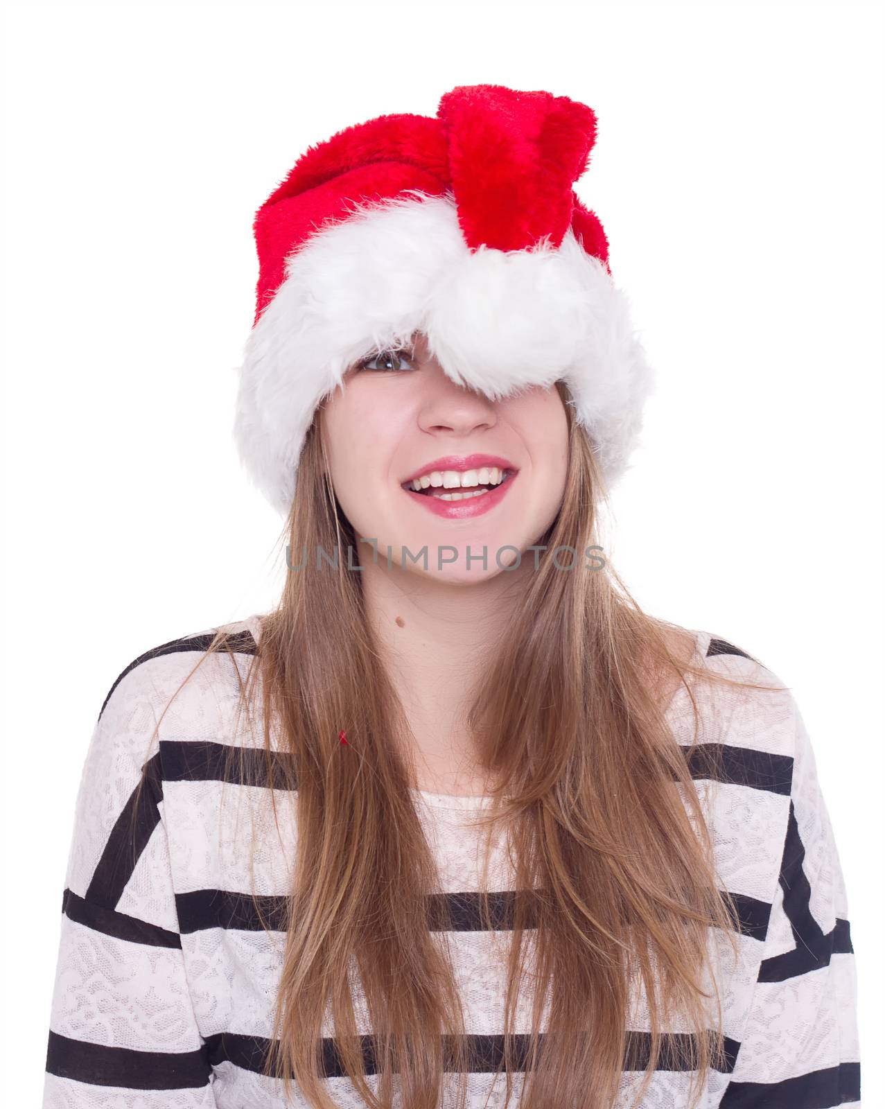 Expressive emotional girl in a Christmas hat on a white background. isolate