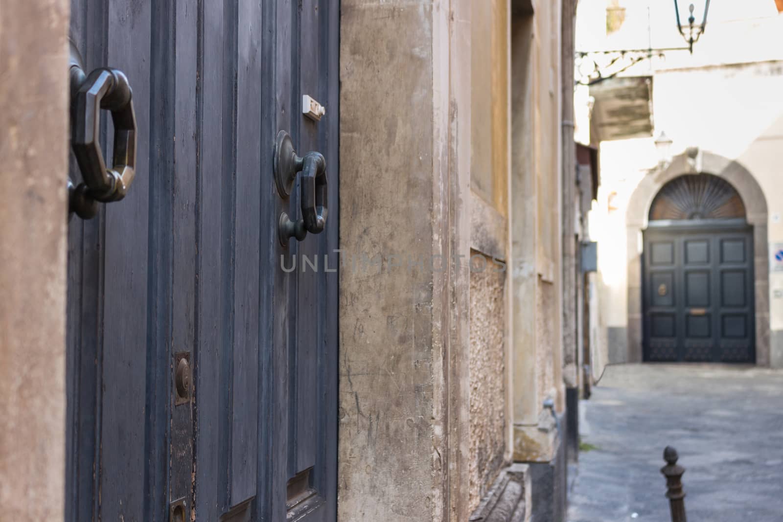 Detail of an old door of an alley Italian