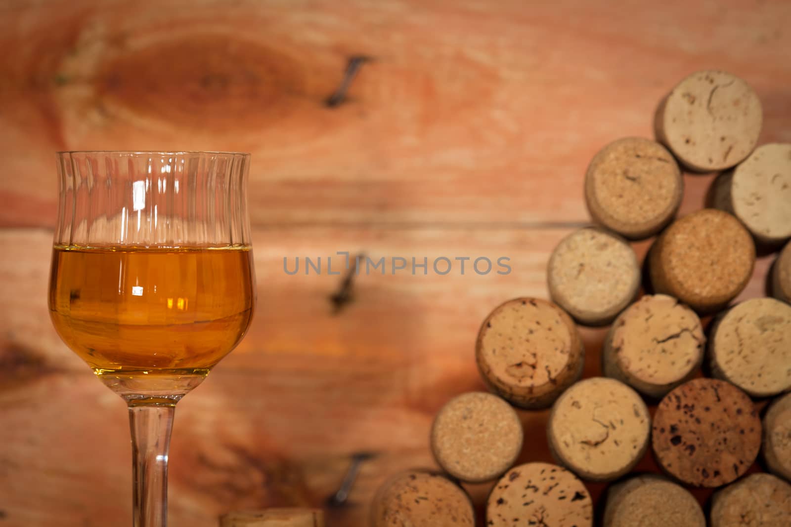 The italian wine with a background of corks