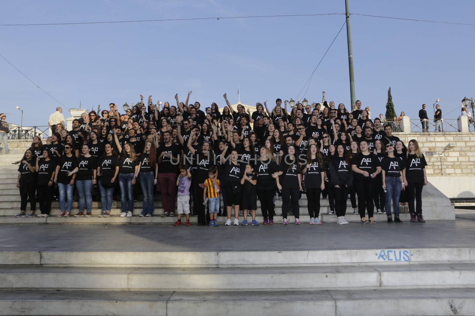 GREECE, Athens: Athens residents pose for a photo while participating in the Walk for Freedom, a global initiative against human trafficking by the A21 Campaign, on October 17, 2015. The walk was one of several held worldwide by the organisation, which aims to raise awareness of human trafficking and provide support to survivors.   	