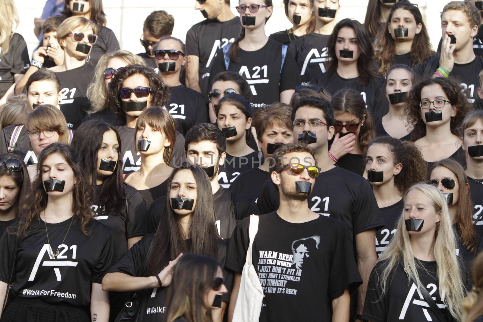 GREECE, Athens: Athens residents pose for a photo while participating in the Walk for Freedom, a global initiative against human trafficking by the A21 Campaign, on October 17, 2015. The walk was one of several held worldwide by the organisation, which aims to raise awareness of human trafficking and provide support to survivors.  		