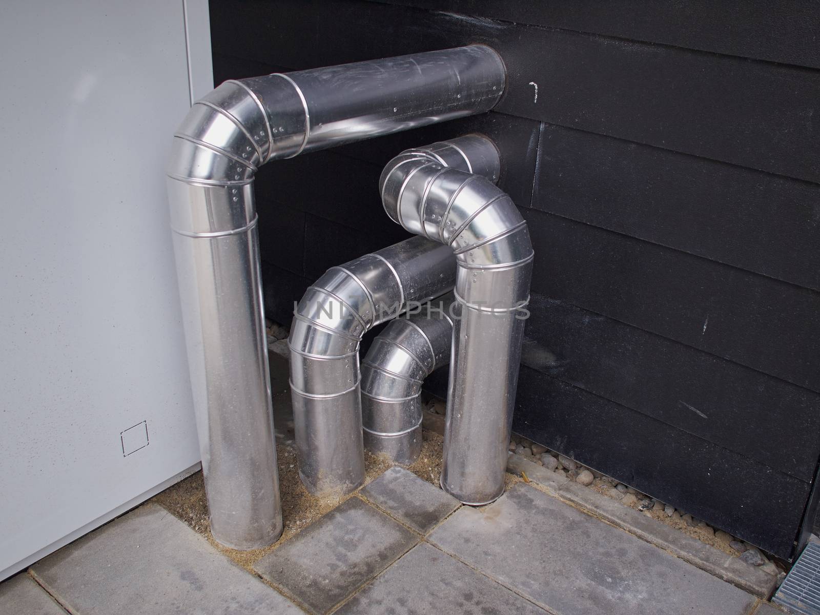 Ventilation system metal pipes of a small residential house 