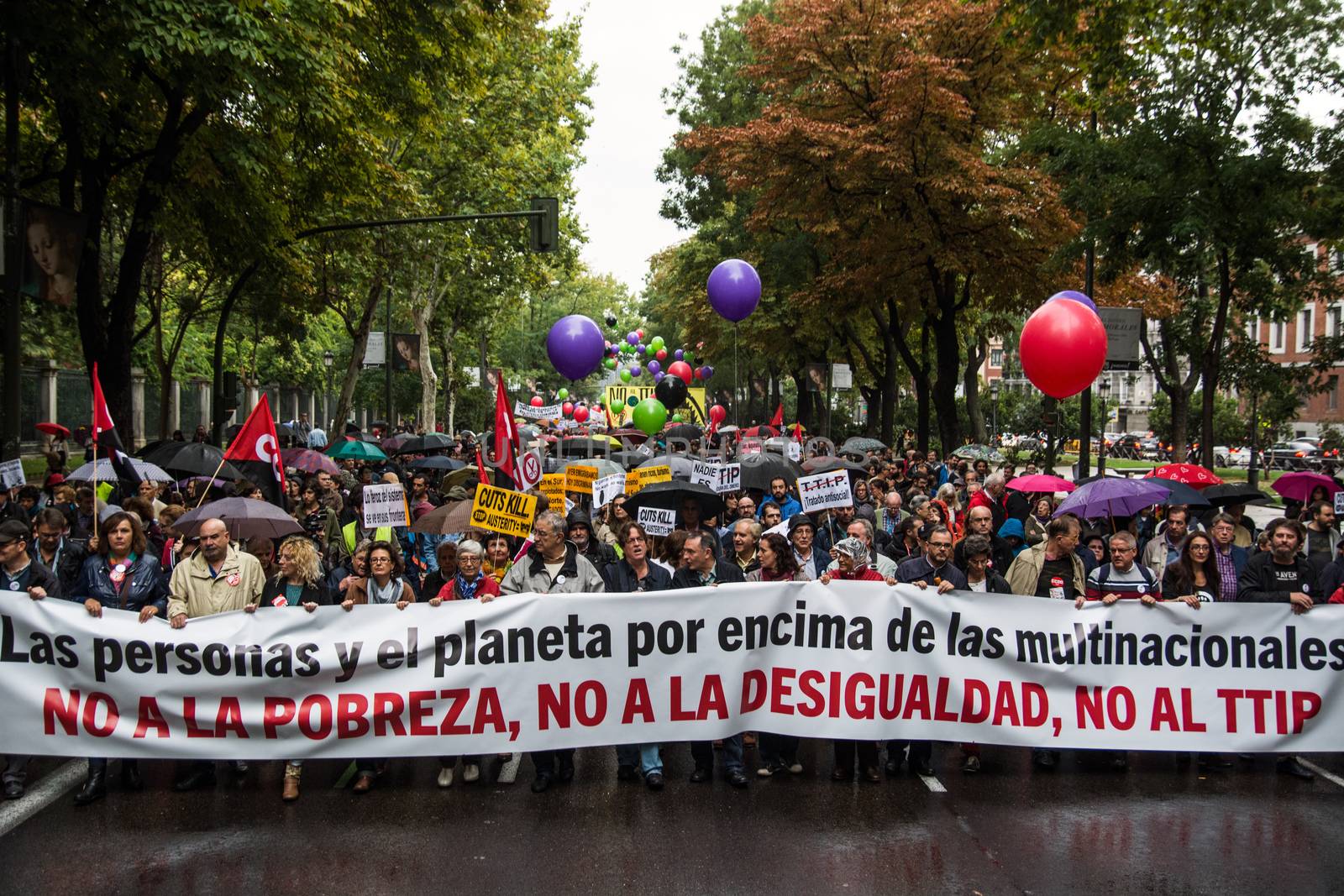 SPAIN, Madrid: Hundreds attend a protest against the Transatlantic Trade and Investment Partnership in Madrid, Spain on October 17, 2015. Leaders are still reaching an agreement on the TTIP, a deal designed to boost the US economy and European Union by removing tariffs and other barriers to trade and foreign investment. Protesters argue the TTIP will support corporations at the expense of citizens, increase poverty and inequality and harm the environment. 