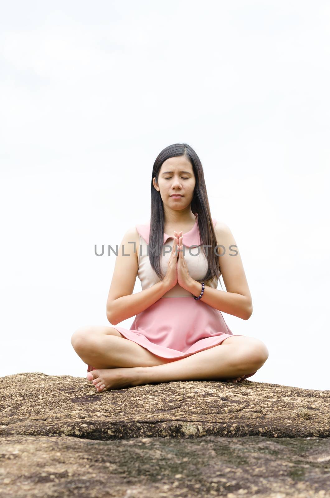 Woman meditation on the mountain. by nikonlike