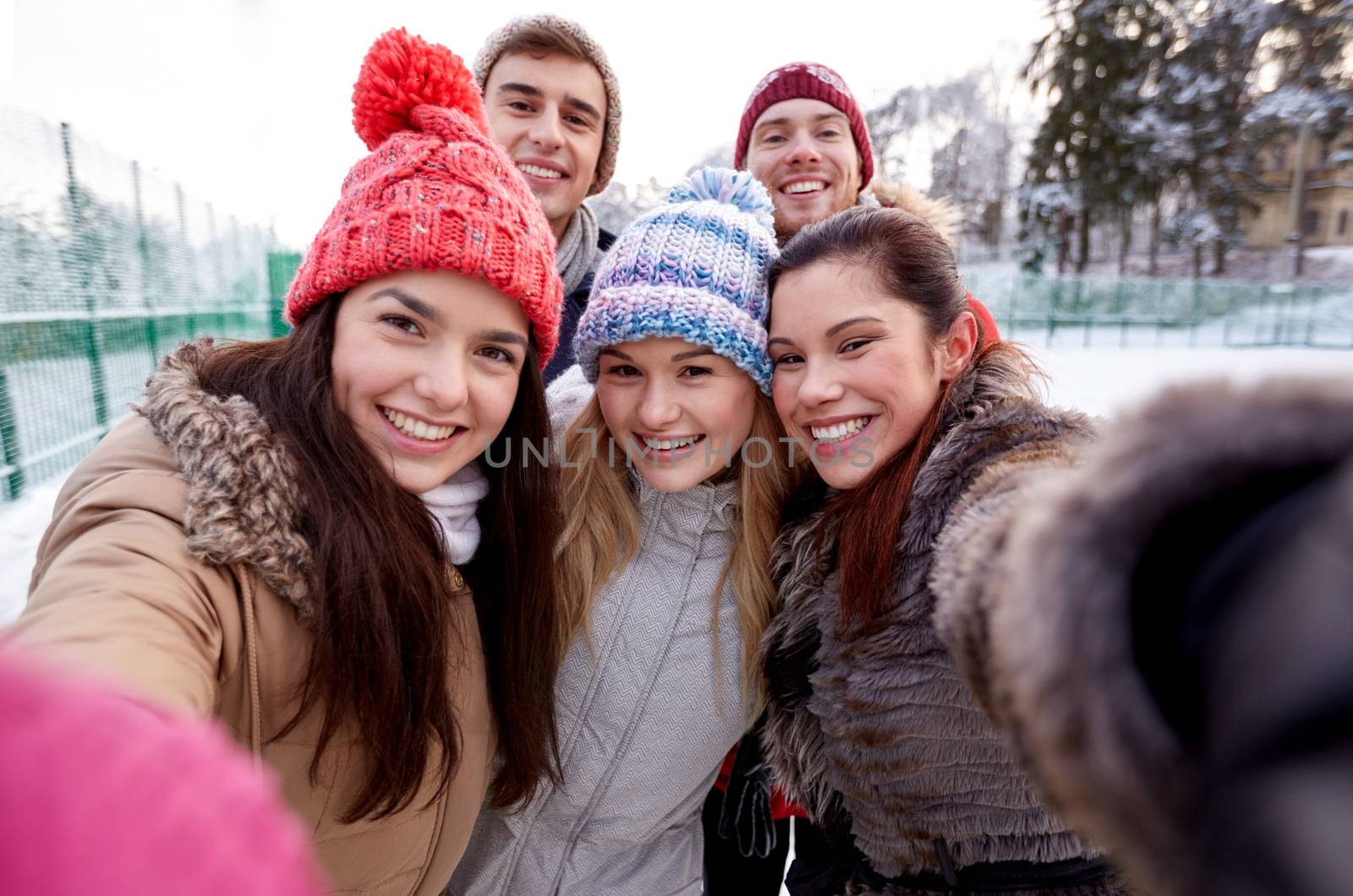 happy friends taking selfie with smartphone by dolgachov