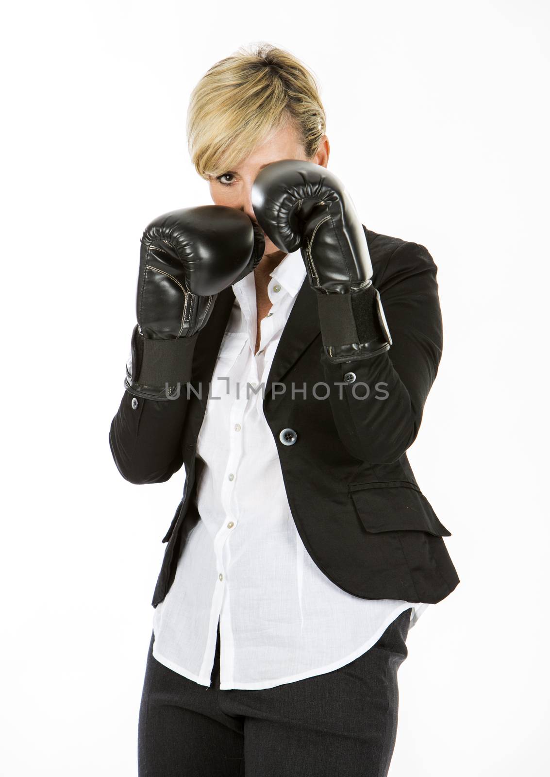 businesswoman with boxing  gloves by Flareimage