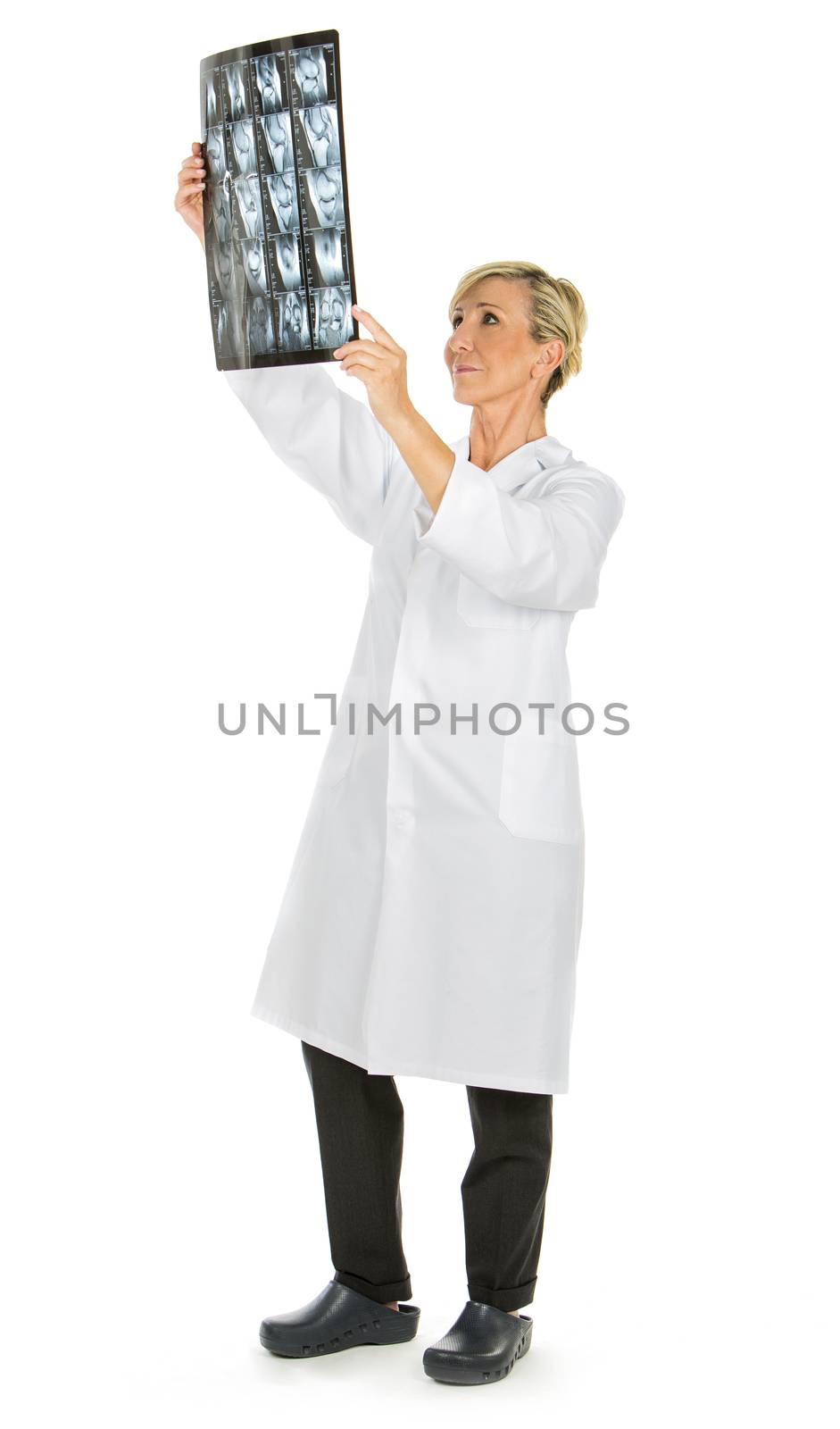 doctor woman looking at patient x-rays by Flareimage