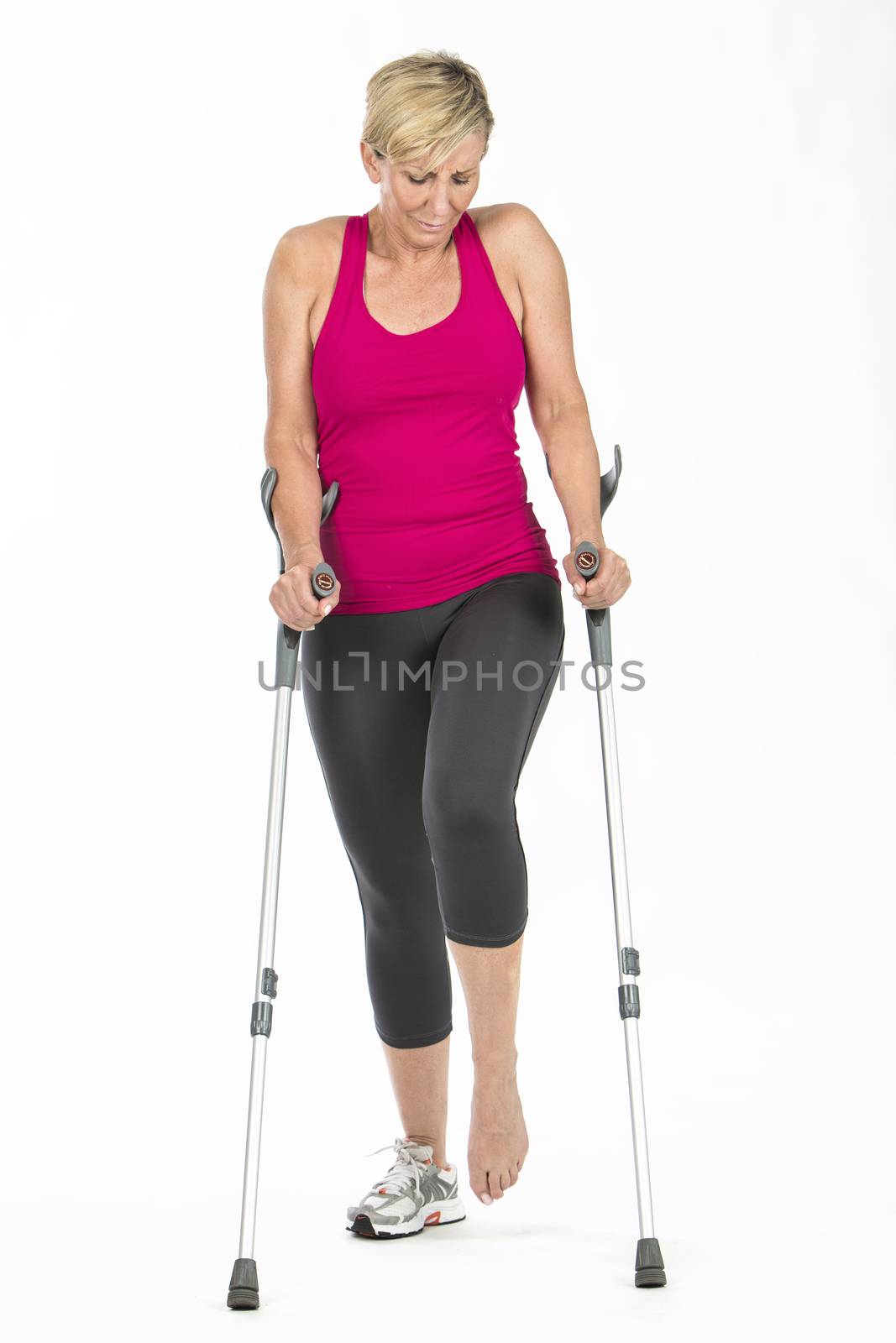 fitness woman walking with crutches