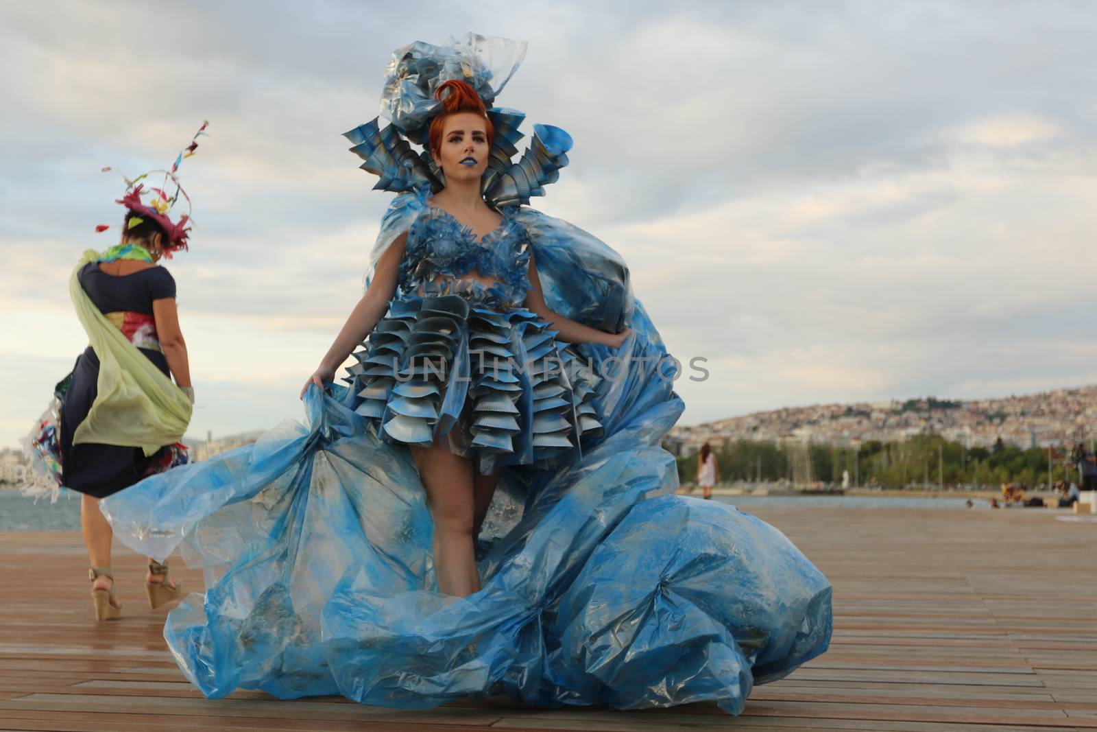 GREECE, Thessaloniki: A quirky outdoor fashion show with clothing made of recycled materials was held on the seafront promenade of Thessaloniki, northern Greece on September 28, 2015.	Professional designers, amateurs, fashionistas, architects and artists inspired by the city, the sea, the sky, the light and the colors of the New Promenade made unique creations from worthless items and recycled fabrics.