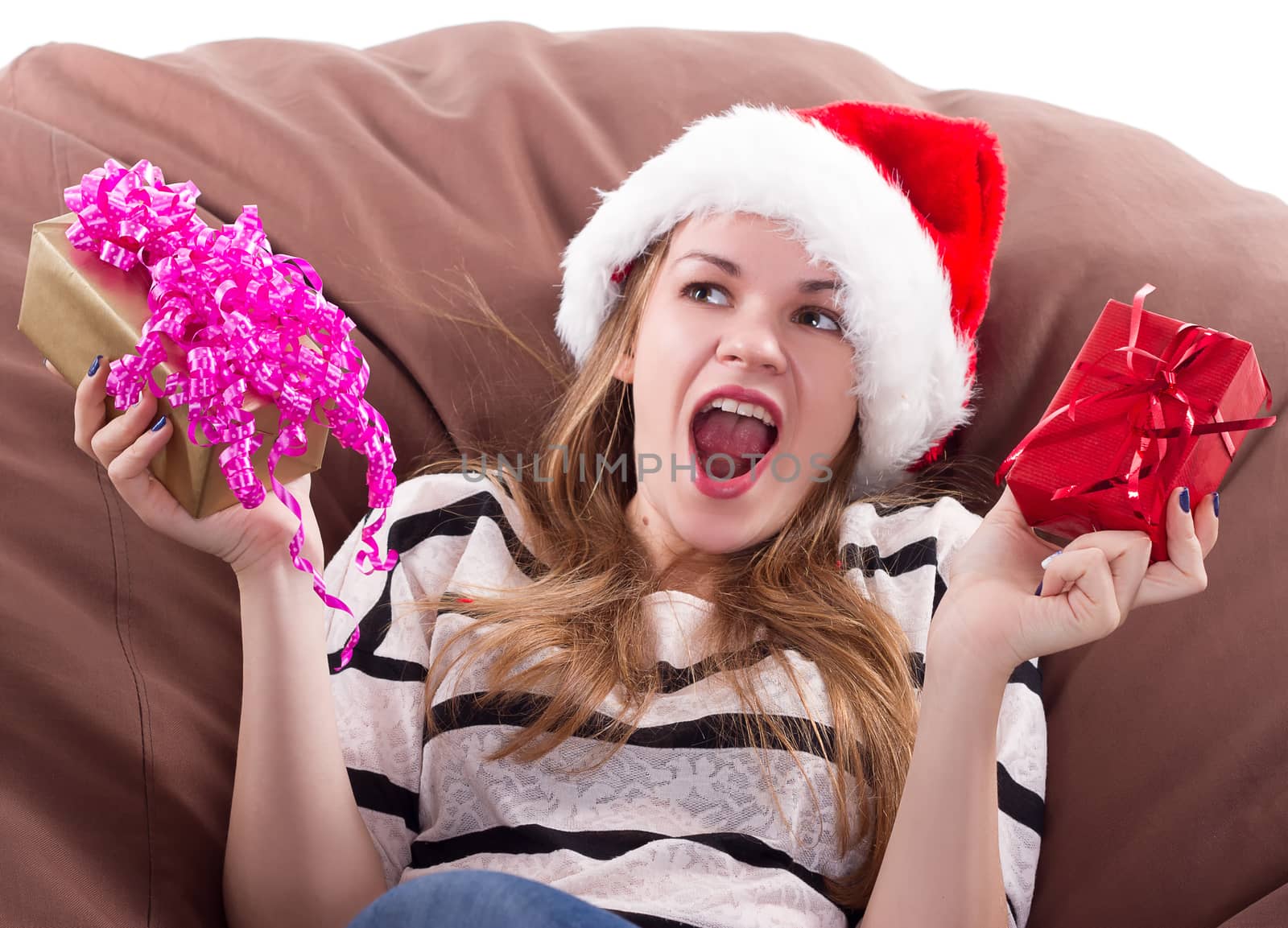attractive girl sits on a chair with a gift in her hands