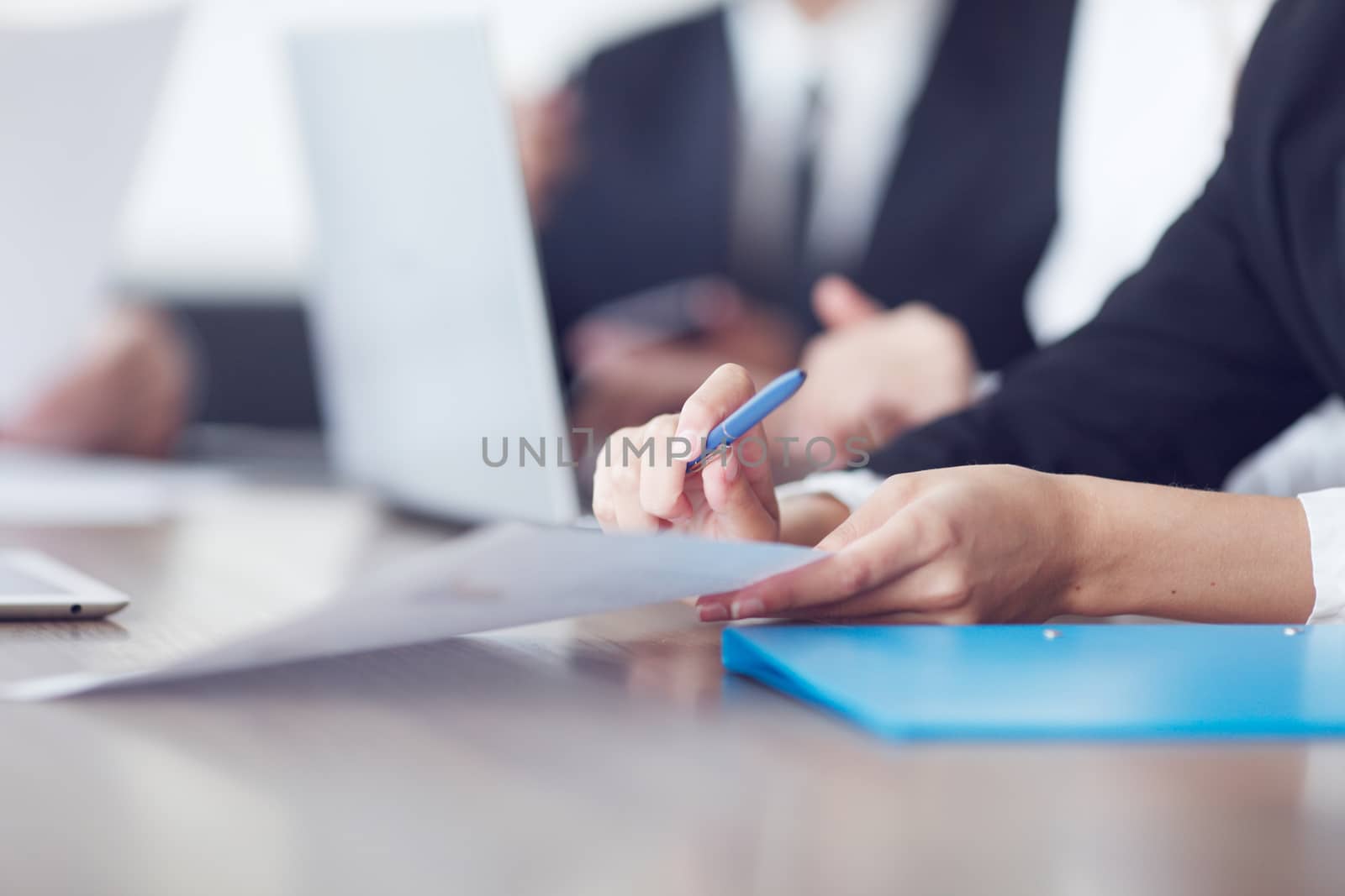 Close-up of Business people working together at a meeting