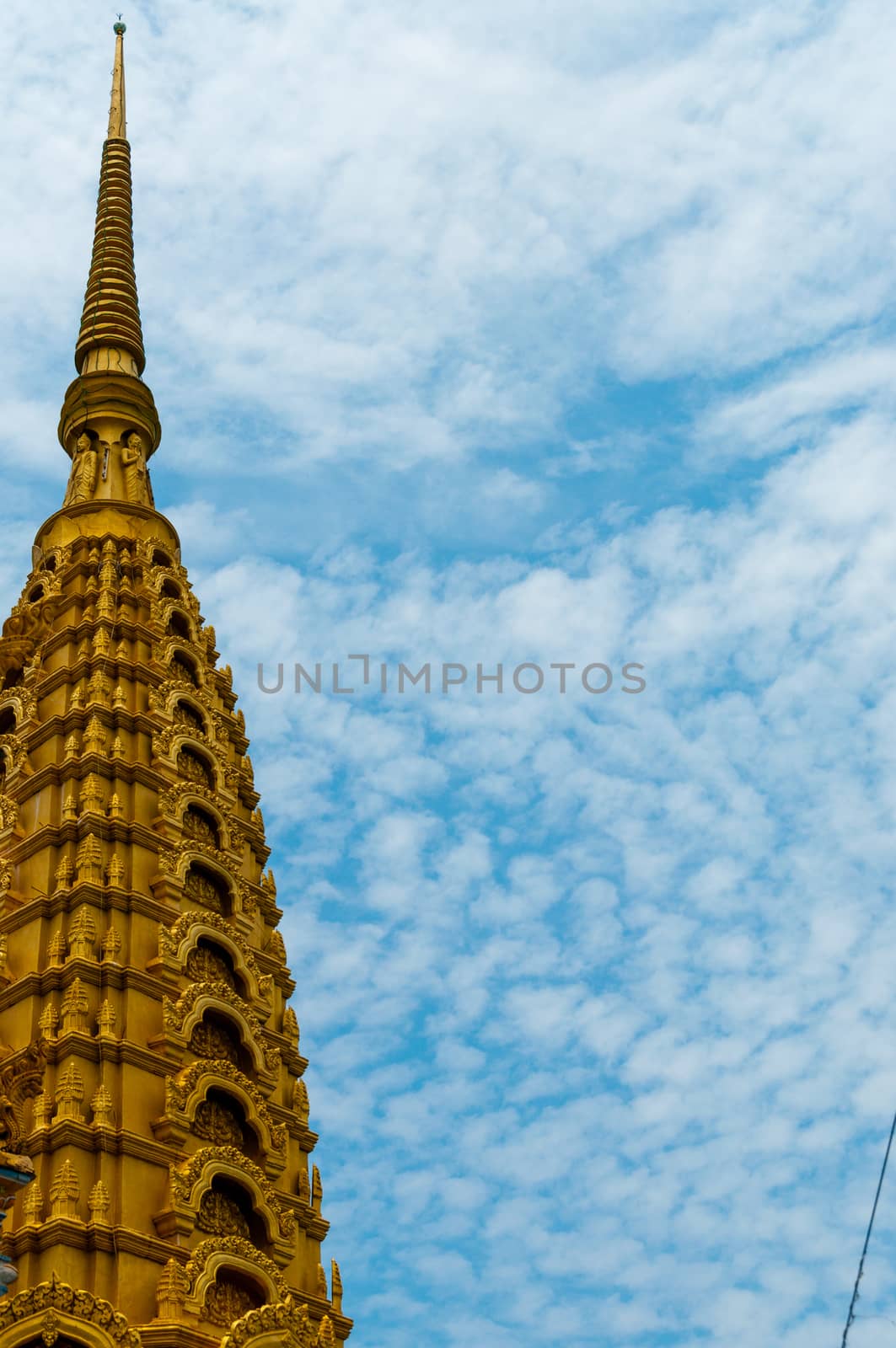 Golden Top in front of beautiful blue and cloudy sky in Asia