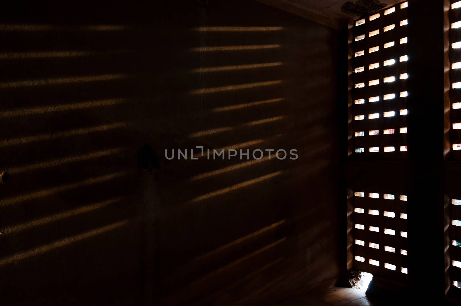 Light falling trough a window on a wall at Tuol Slen in Phnom Penh Cambodia