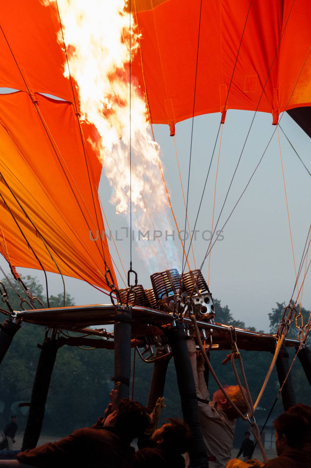 Hot air balloon crew starting fire in Bagan Myanmar Burma