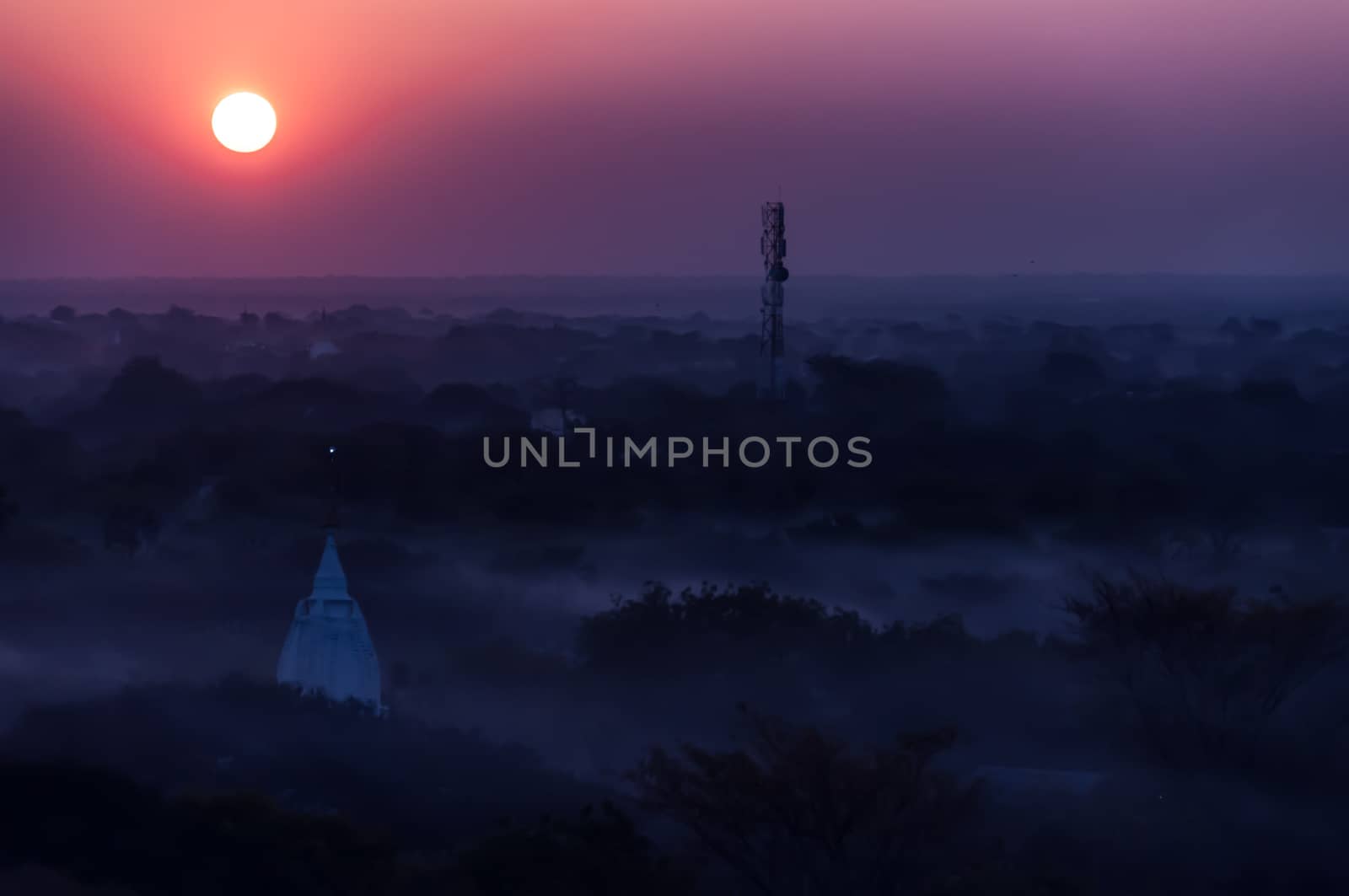 Sunrise over temples of misty and foggy Bagan in Myanmar Burma