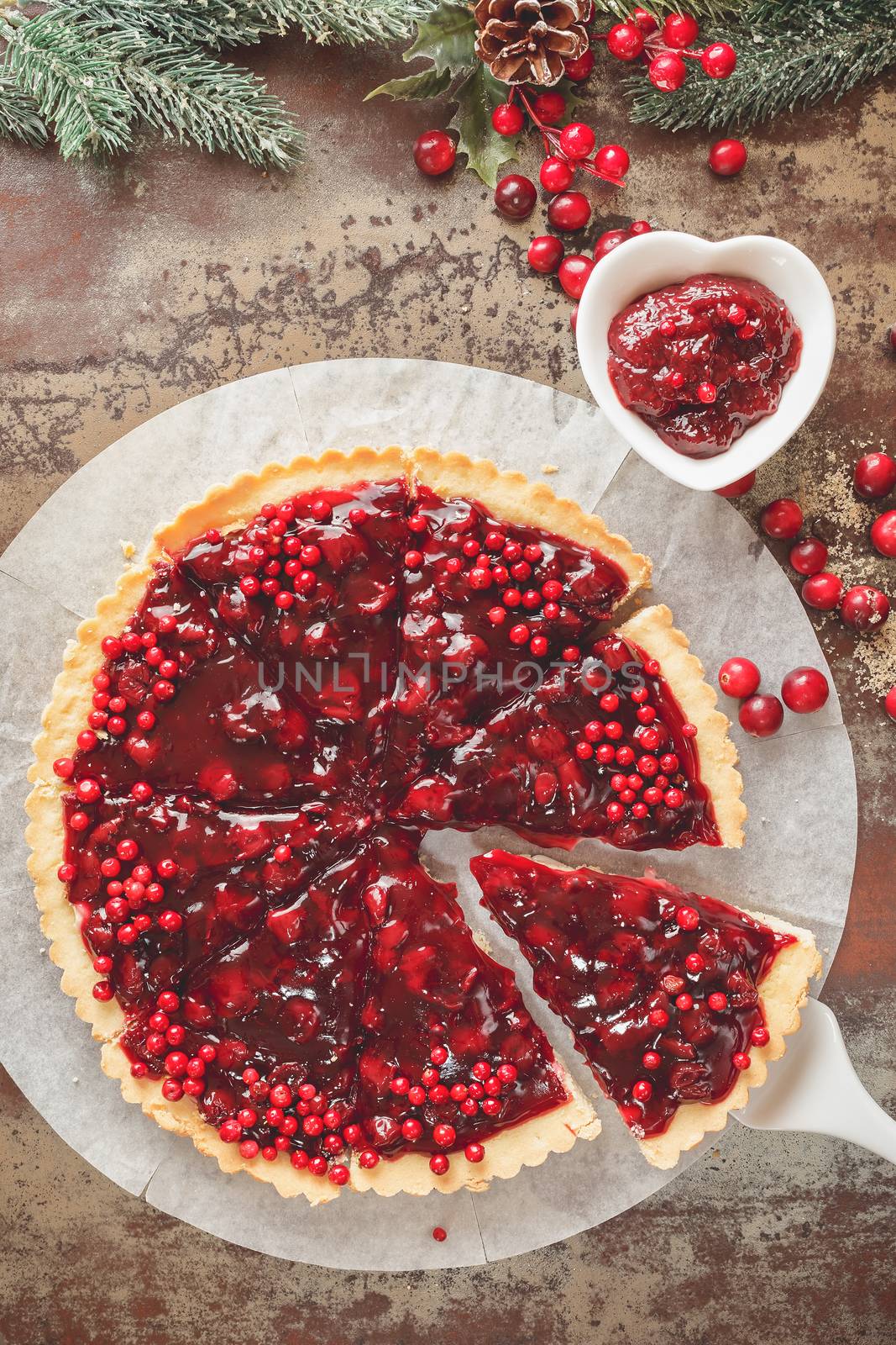 Delicious cranberry tart with jellied and fresh cranberries for Christmas. Top view, vintage toned
