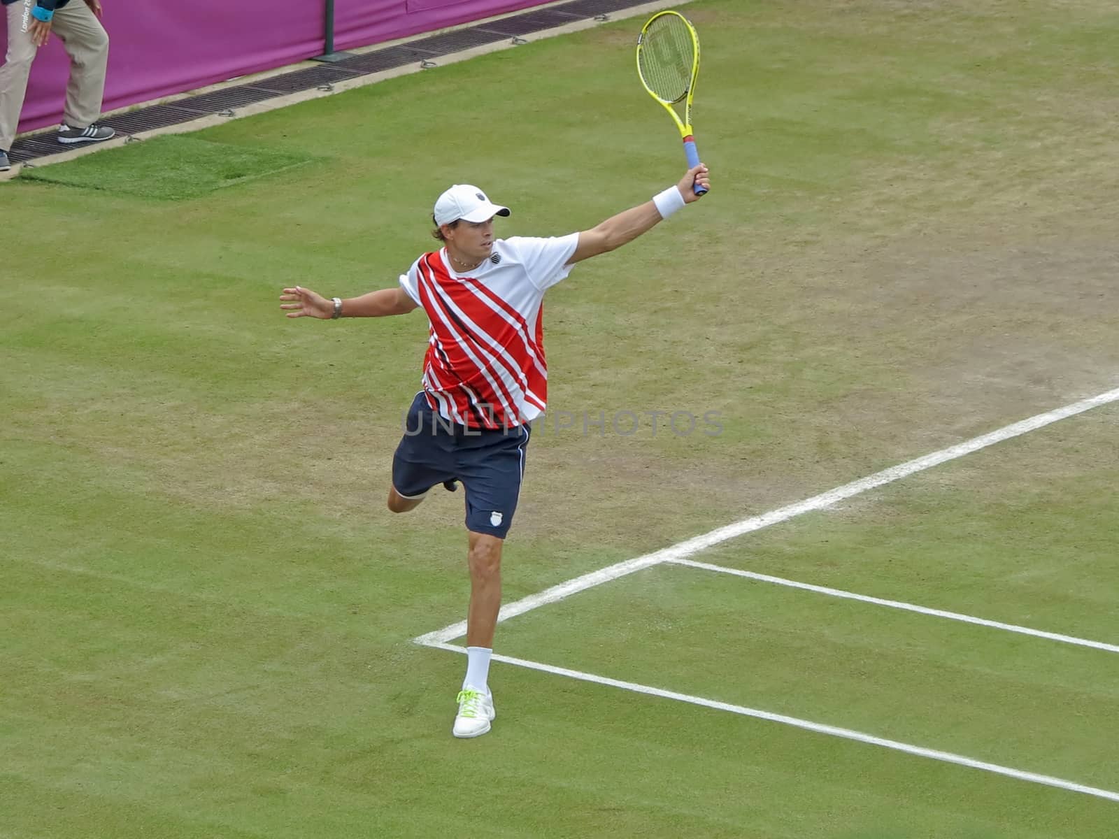 WIMBLEDON, ENGLAND - August 2nd, 2012 - Mike Bryan during one of his double matches at the summer Olympics in London in 2012. They went on to win the gold medal