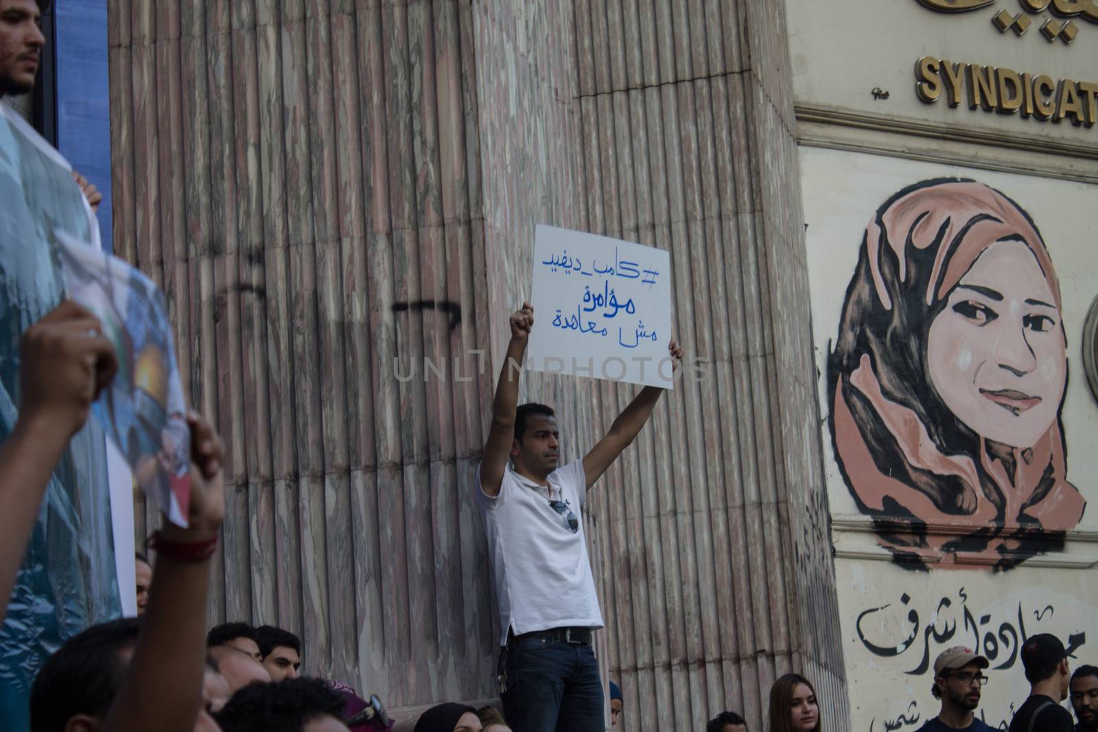 EGYPT, Cairo: Protesters gathered outside the Syndicate of Journalists building in Cairo, Egypt on October 18, 2015 in a show of support for Palestinians. The activists demonstrated against the recent attacks in Jerusalem, the West Bank and Gaza. They raised the flag of Palestine as some people stood on Israel's flag in anger.