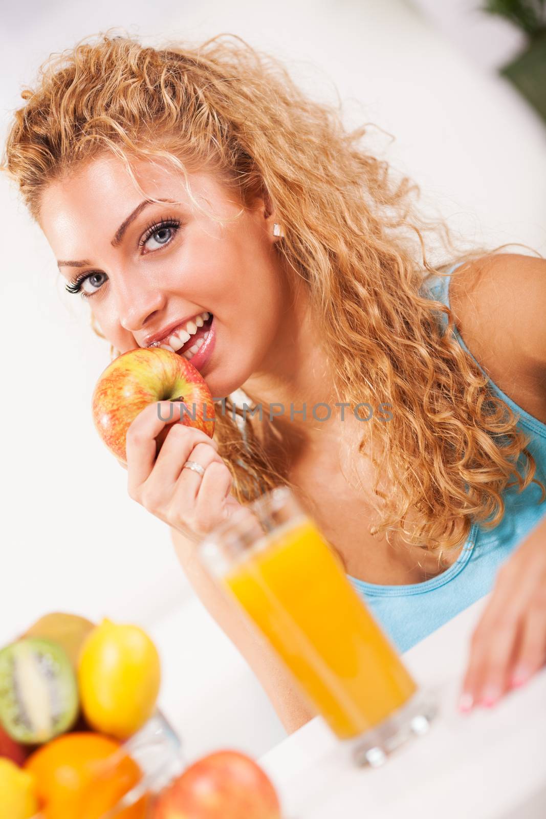 Beautiful young woman with fruits