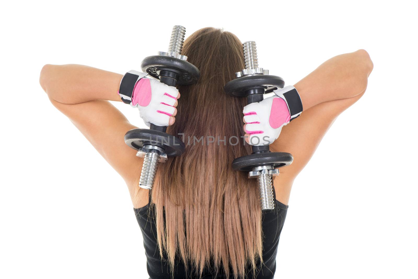 Sporty young woman doing exercise to strengthen her triceps with dumbbells.