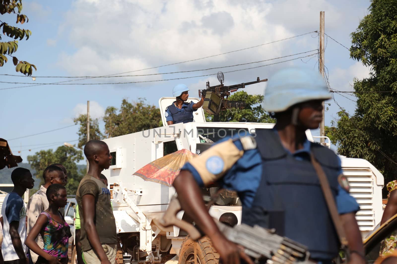 CENTRAL AFRICAN REPUBLIC, Bangui : Soldiers of the United Nations Multidimensional Stabilization Mission in Central African Republic, Minusca, passe on a street in Bangui, as they patrol in the city, on October 18, 2015. The Central African Republic descended into bloodshed more than two years ago after long time president Francois Bozize, a Christian, was ousted by Seleka rebels, triggering the worst crisis since independence in 1960. On September 29, 2015, Bangui returned to only relative calm after three days of inter-community violence which left at least 40 dead and 100 injured according to the UN Refugee Agency UNHCR. Some 27,000 inhabitants of Bangui have also fled to displaced people's camps