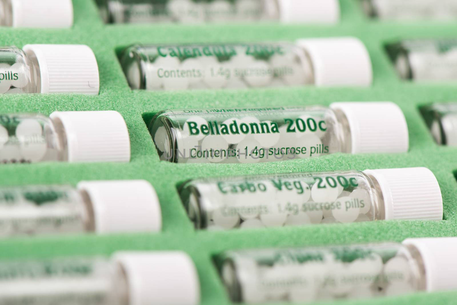 Closeup of bottles with homeopathic remedies. Belladonna pills.