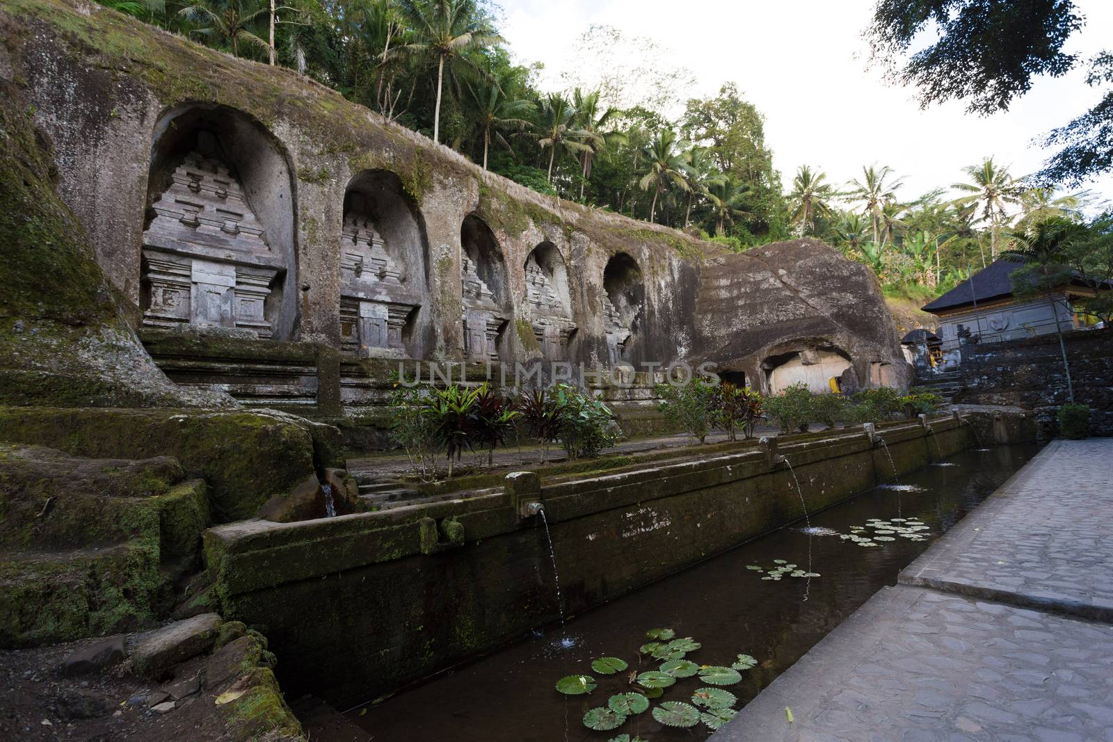 unung Kawi Temple. Gunug Kawi is an ancient temple situated in Pakerisan River, near Tampaksiring village in Bali. The archaeological complex is carved out of the living rock, dating to 11th century.