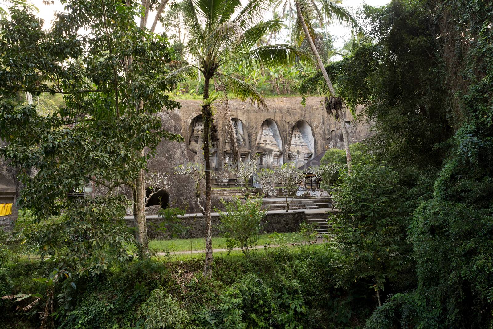 unung Kawi Temple. Gunug Kawi is an ancient temple situated in Pakerisan River, near Tampaksiring village in Bali. The archaeological complex is carved out of the living rock, dating to 11th century.