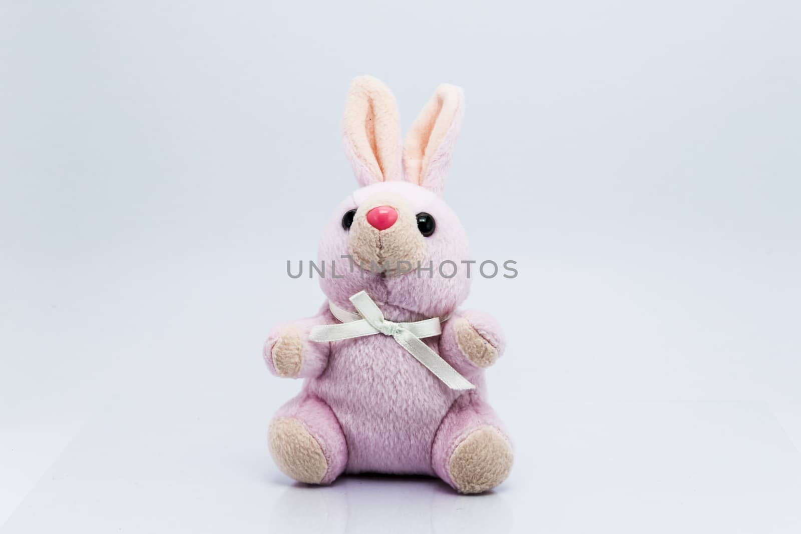 Funny knitted rabbit toy isolated on white background  by teerawit