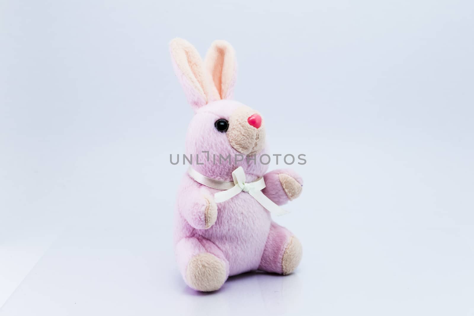 Funny knitted rabbit toy isolated on white background  by teerawit