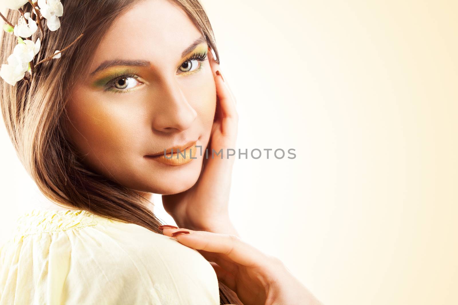 Young Beautiful woman with flowers in hair.