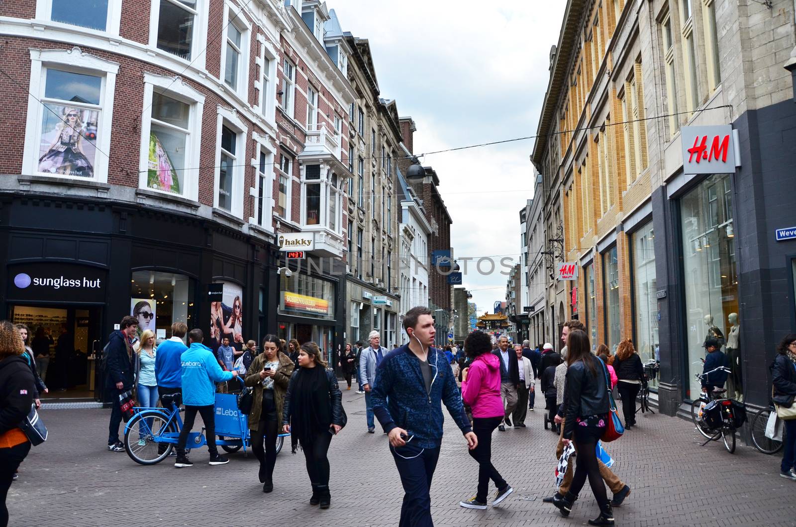 The Hague, Netherlands - May 8, 2015: People shopping on venestraat shopping street in The Hague by siraanamwong