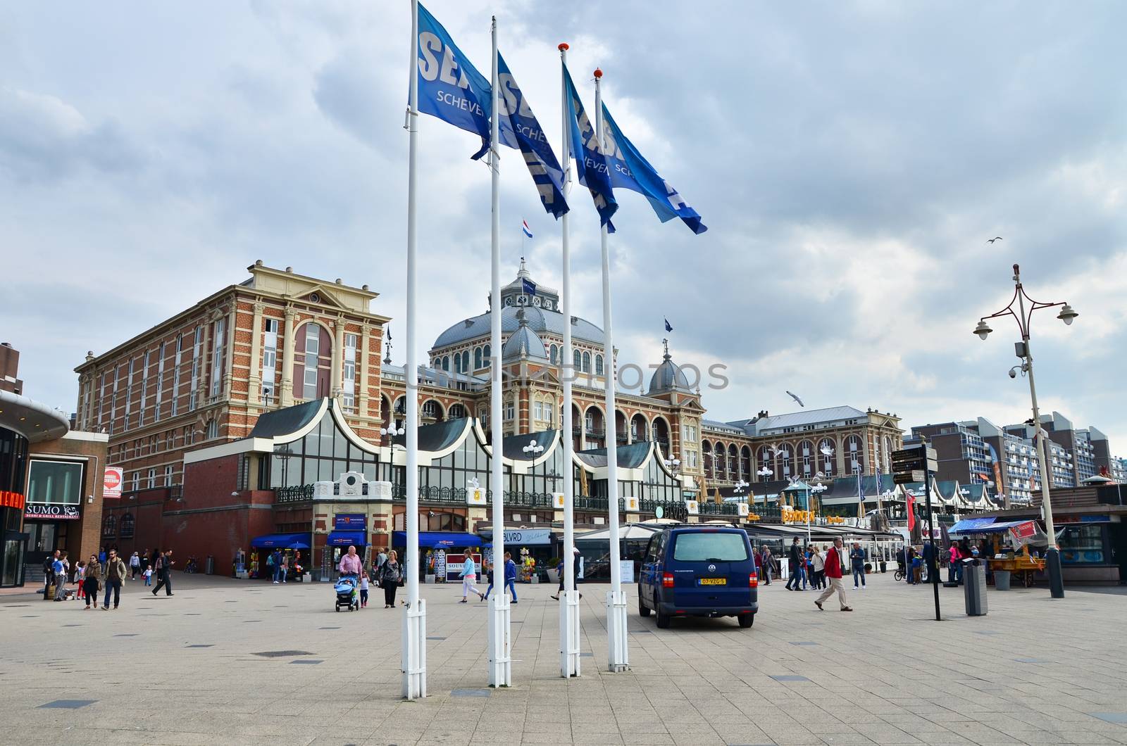 The Hague, Netherlands - May 8, 2015: Tourists at Kurhaus of Scheveningen, The Hague in the Netherlands is a hotel which is called the "Grand Hotel Amrath Kurhaus The Hague" since October 2014. It is located in the main seaside resort area, near the beach.