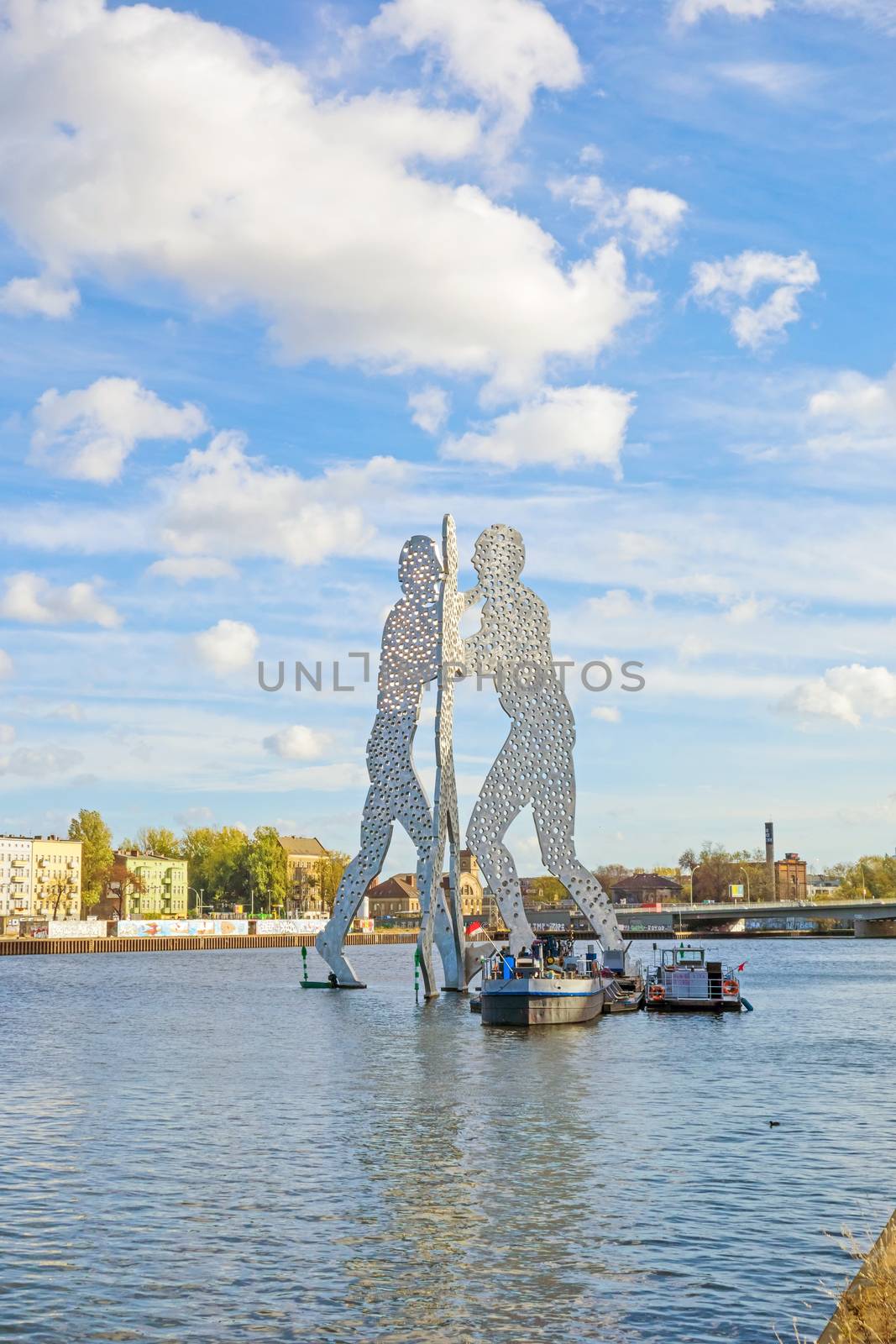 Berlin, Germany - October 29, 2013: Molecule Man sculpture by Jonathan Borofsky. The sculpture represent the intersection of the districts Treptow, Kreuzberg and Friedrichshain.