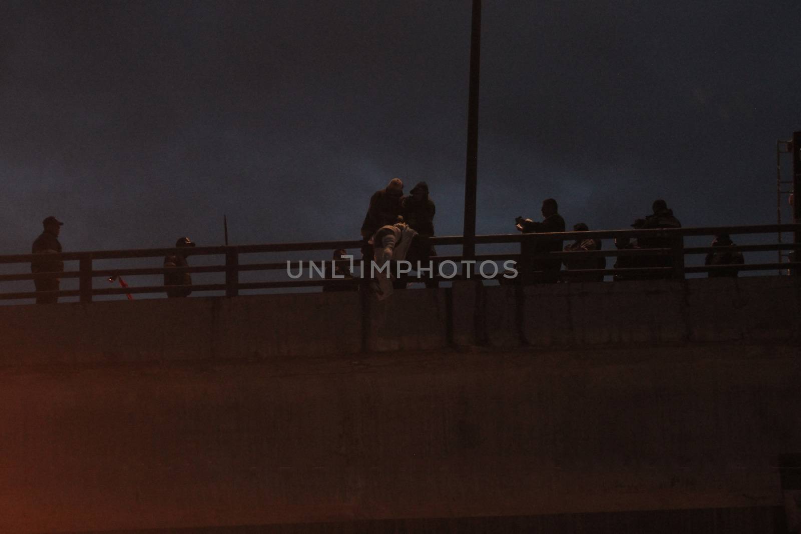 [Warning: graphic content]MEXICO, Iztapalapa: A dead man hangs from the Puente La Concordia, a bridge in Iztapalapa, Federal District, Mexico City, Mexico on October 19, 2015. The victim, reportedly close to age 30, was found with his head and body wrapped, and showed signs of torture when he was discovered around 4am local time. While the man's death is still being investigated, Iztapalapa has been listed among the most dangerous neighborhoods in the world.