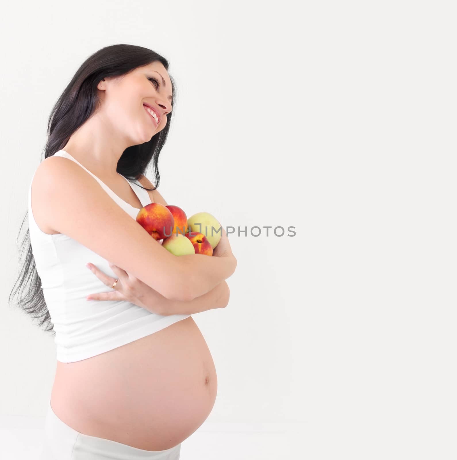pregnant woman with fruits by rudchenko