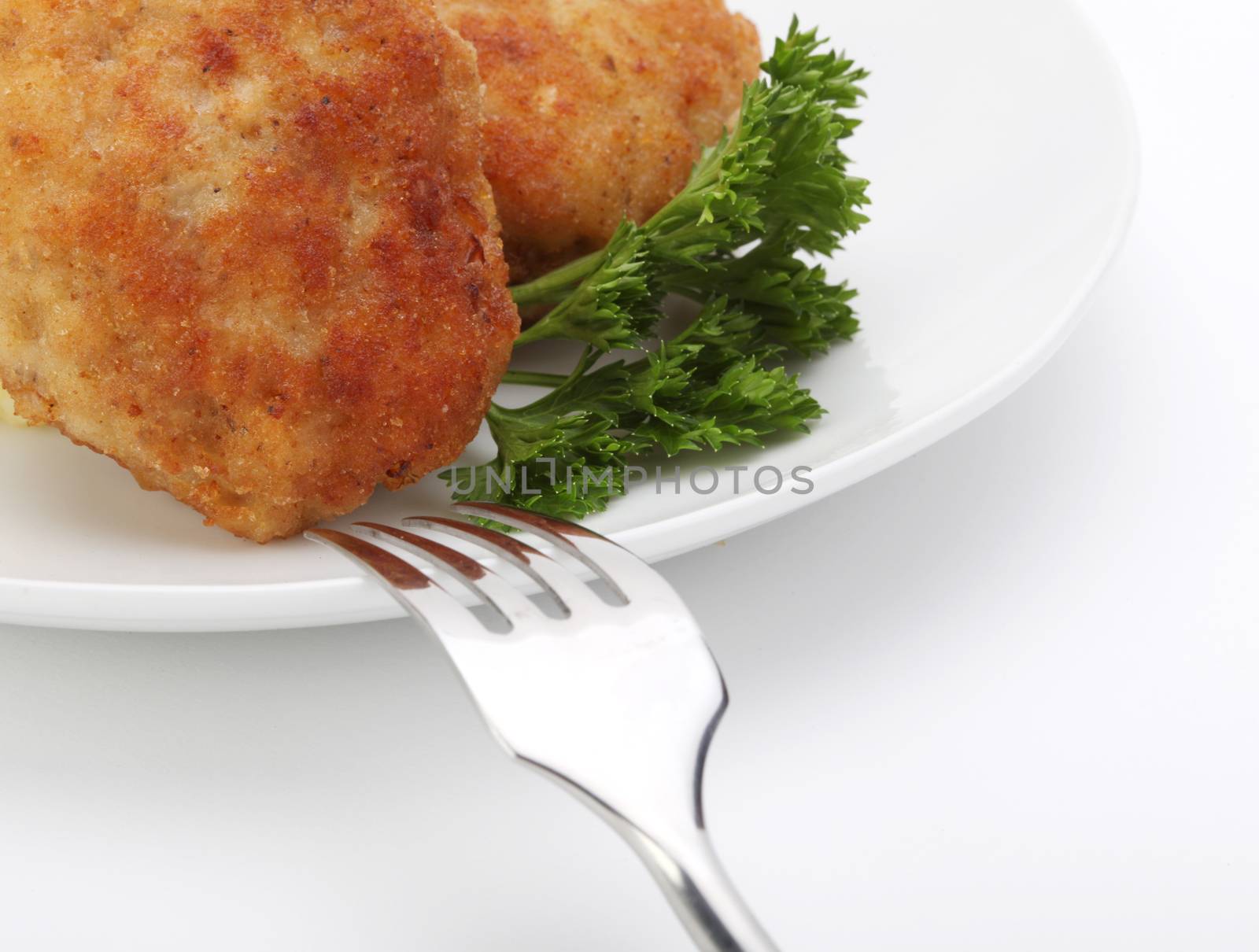 roasted cutlets with fork by rudchenko