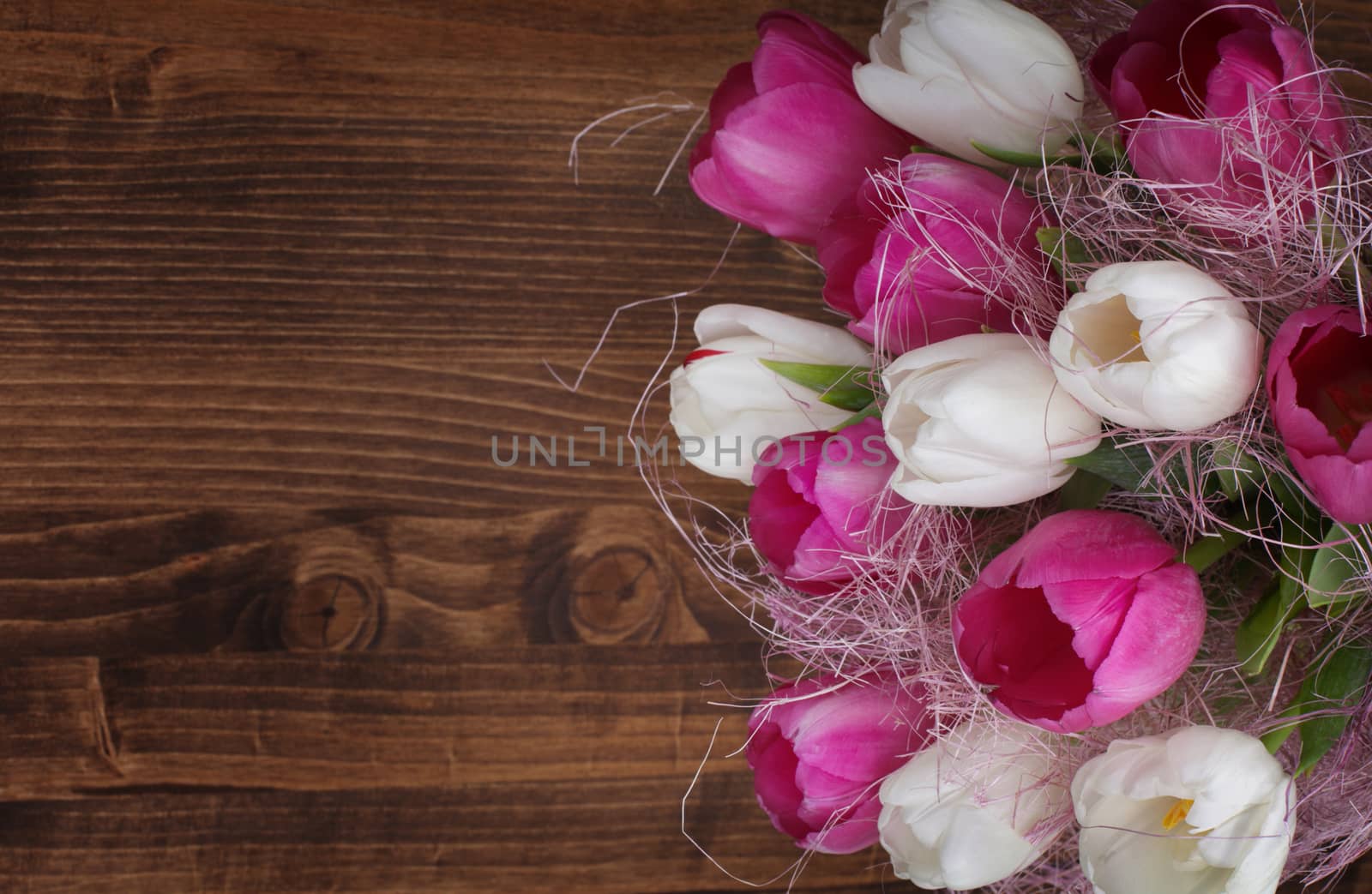 tulip bouquet on wood background by rudchenko