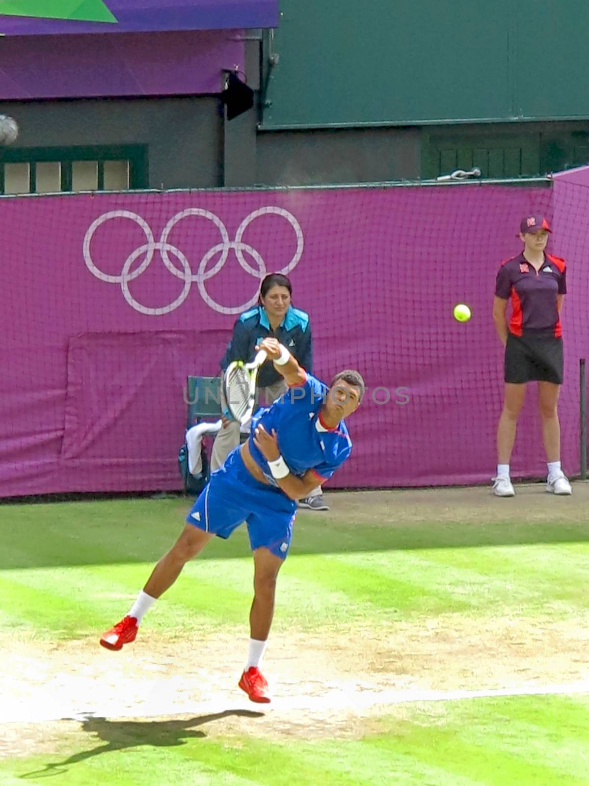 WIMBLEDON, ENGLAND - August 2nd, 2012 - Jo-Wilfried Tsonga during one of his singles matches at the summer Olympics in London in 2012. He made it to the quarterfinals in the tournament.