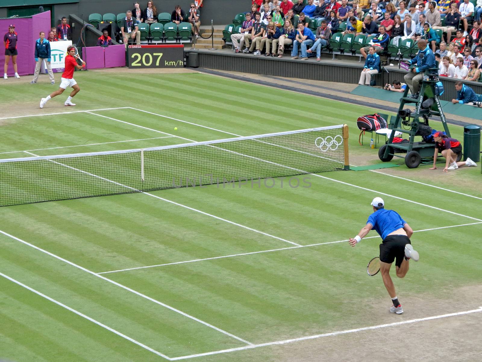 WIMBLEDON, ENGLAND - August 2nd, 2012 � Roger Federer and John Isner during their singles matches at the summer Olympics in London in 2012. Roger Federer came 2nd, silver medal and John Isner made it to the quarterfinals in the tournament