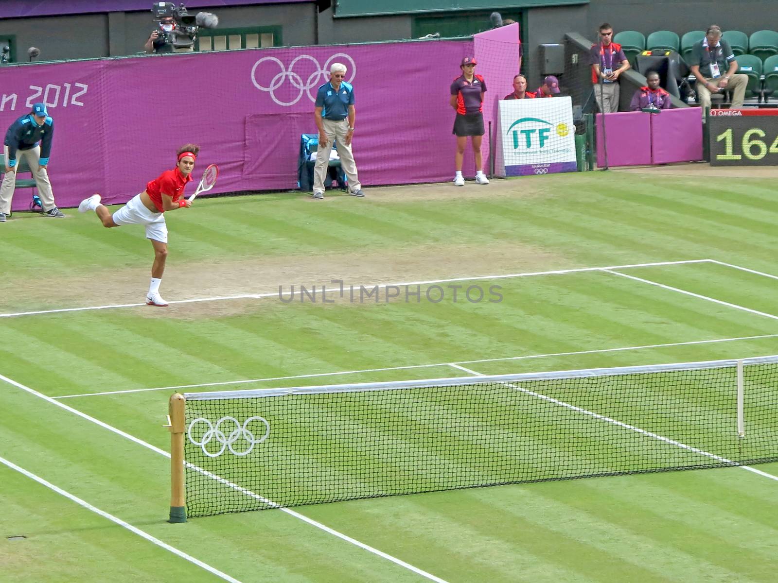 WIMBLEDON, ENGLAND - August 2nd, 2012 - Roger Federer during one of his singles matches at the summer Olympics in London in 2012. He came 2nd and won the silver medal in the tournament.