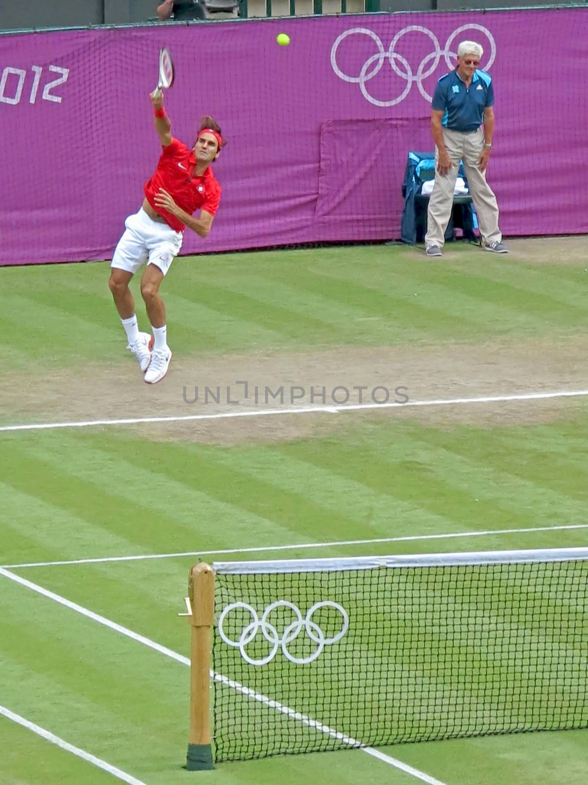 WIMBLEDON, ENGLAND - August 2nd, 2012 - Roger Federer during one of his singles matches at the summer Olympics in London in 2012. He came 2nd and won the silver medal in the tournament.