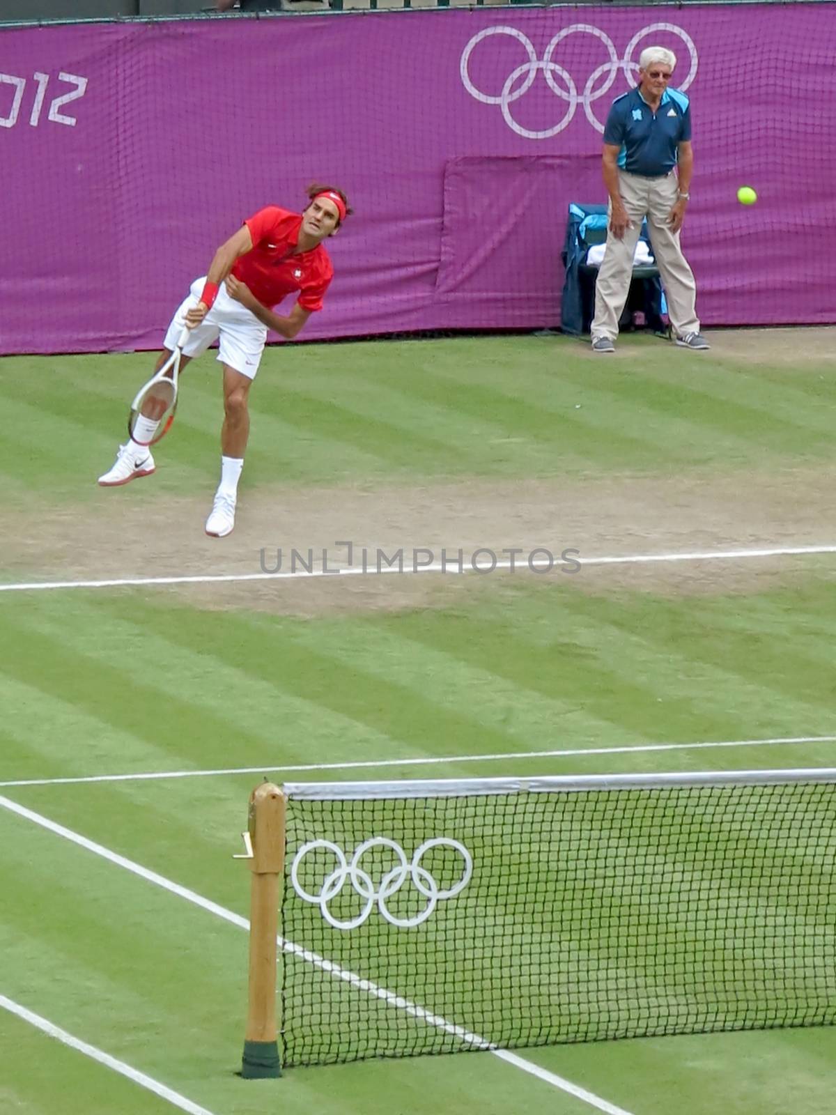 WIMBLEDON, ENGLAND - August 2nd, 2012 - Roger Federer during one of his singles matches at the summer Olympics in London in 2012. He came 2nd and won the silver medal in the tournament.