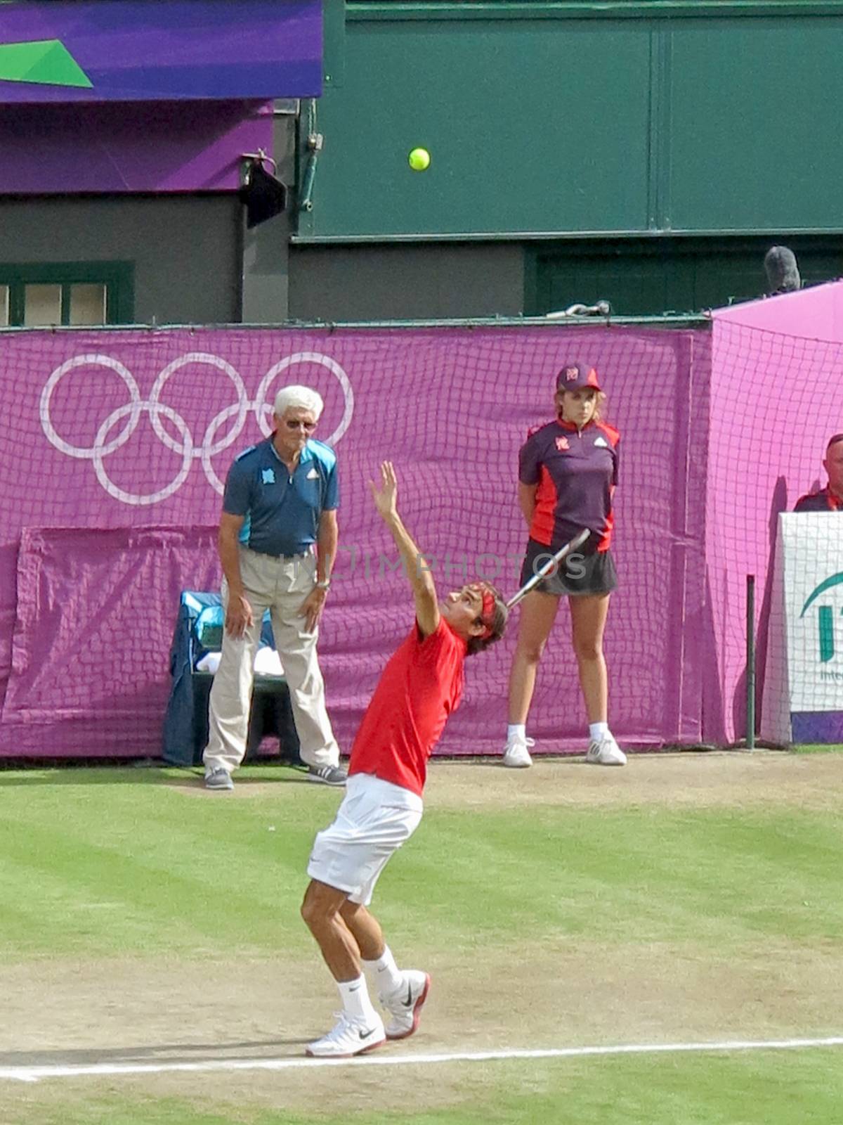 WIMBLEDON, ENGLAND - August 2nd, 2012 - Roger Federer during one of his singles matches at the summer Olympics in London in 2012. He came 2nd and won the silver medal in the tournament.