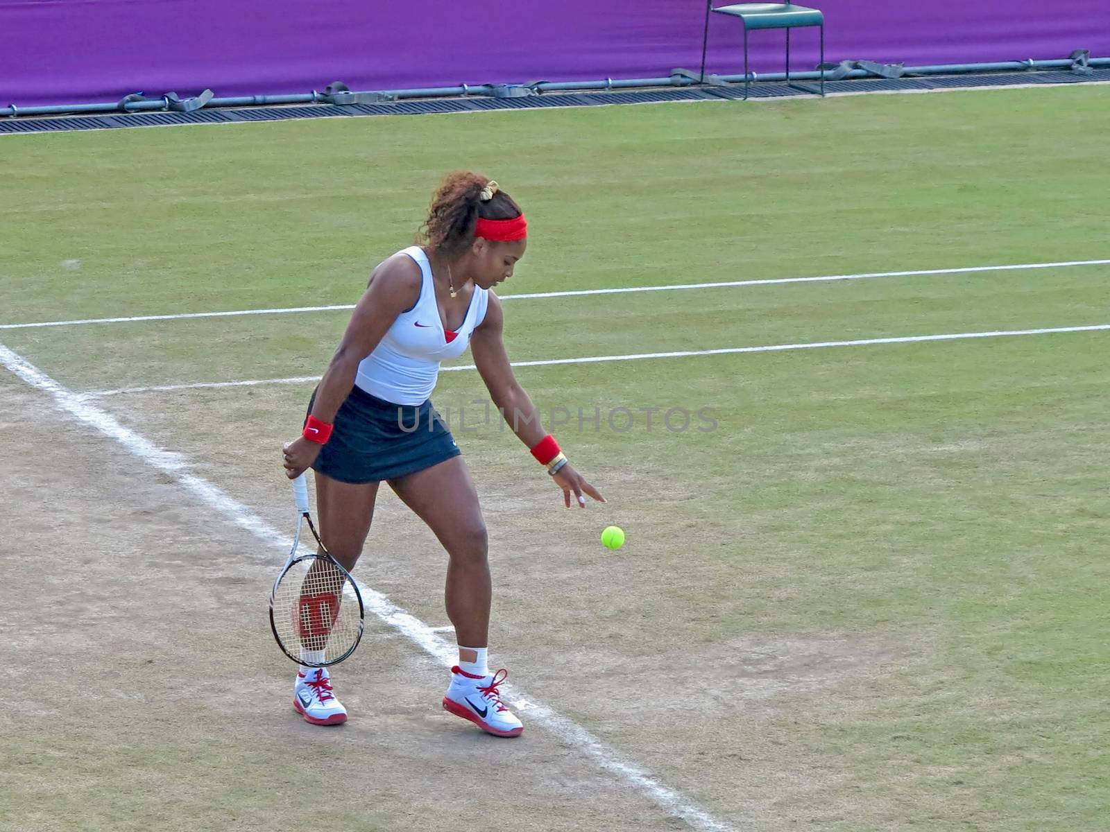 WIMBLEDON, ENGLAND - August 2nd, 2012 � Serena Williams during one of her doubles matches at the summer Olympics in London in 2012. Serena and Venus Williams went on to win the women�s doubles and take home the gold medal.