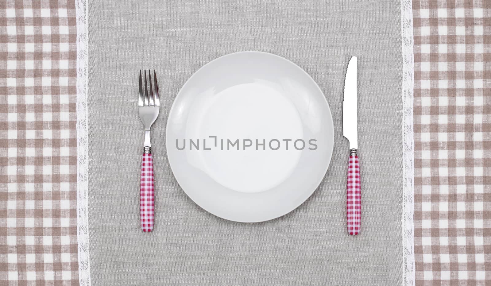 empty plate with fork and knife by rudchenko